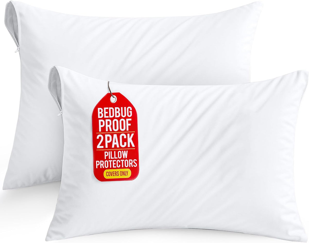 Two white zippered pillow protectors shown stacked, front cover with a red hang tag and visible zipper opening.
