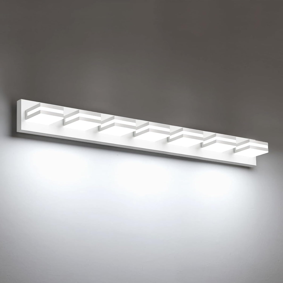 Long white LED vanity light with eight square illuminated modules mounted on a gray wall.
