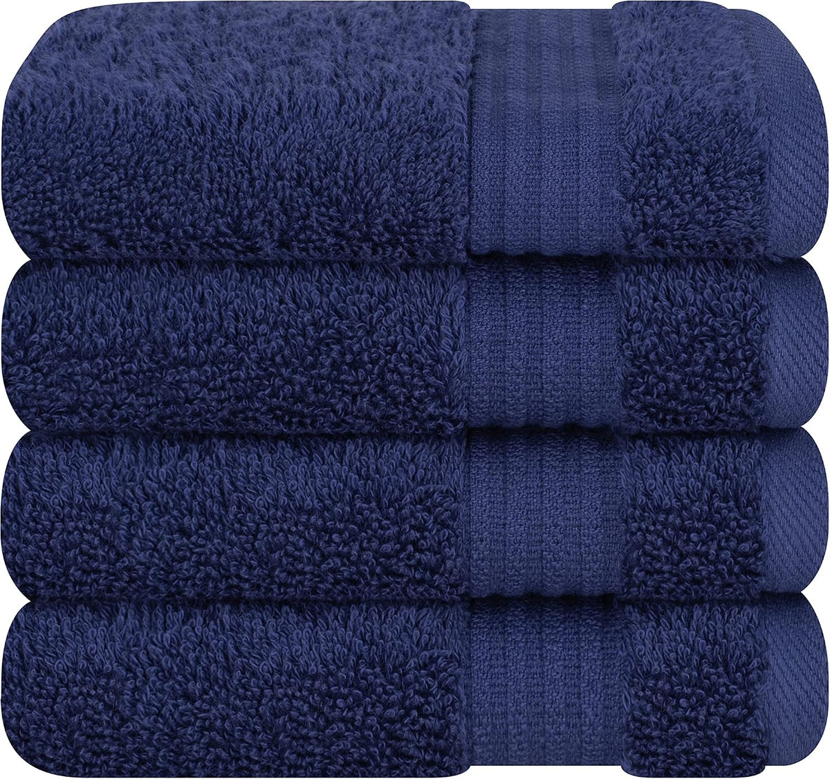 Stack of four folded navy blue bath towels highlighting pile and decorative band