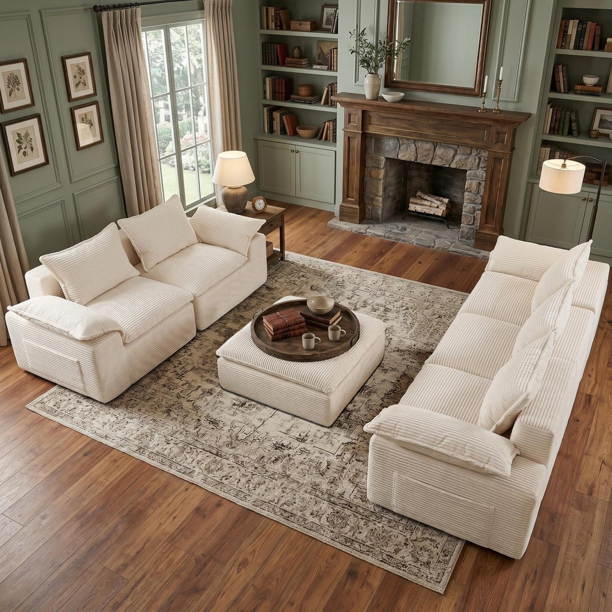 Cream corduroy modular sectional with matching ottoman arranged in a living room with fireplace, top view