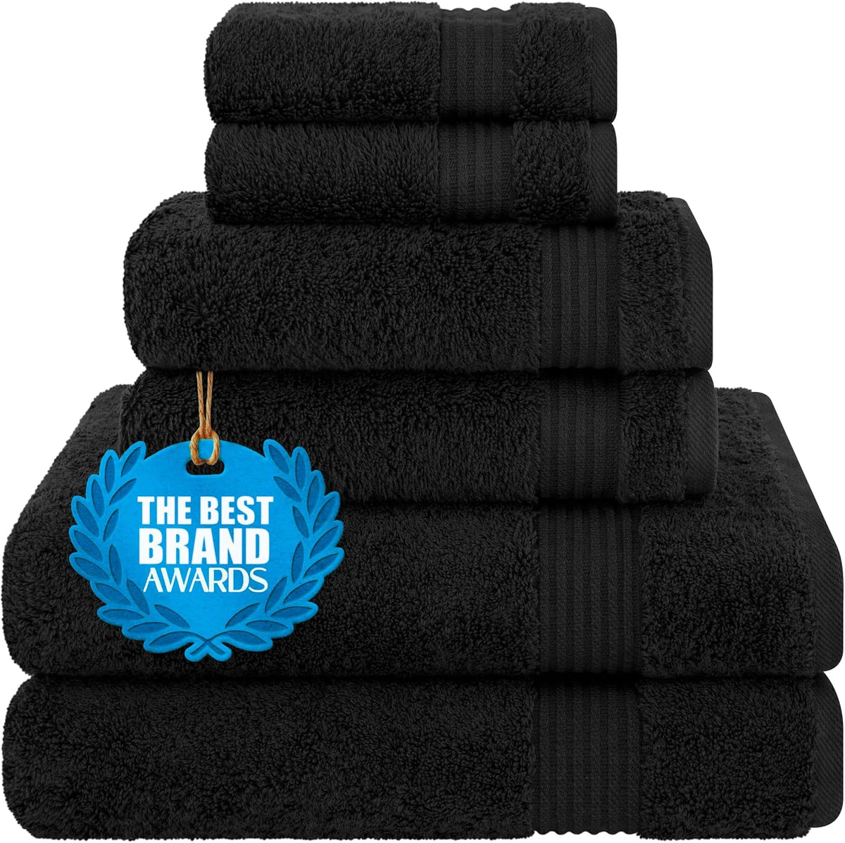 Neatly stacked set of black folded towels showing textured border details and an award tag.
