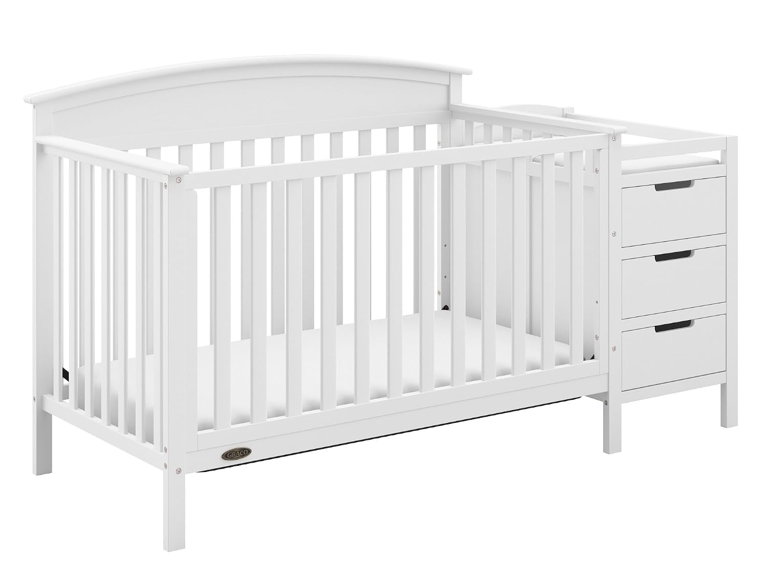 White convertible crib with attached three-drawer changing table shown at a slight angle