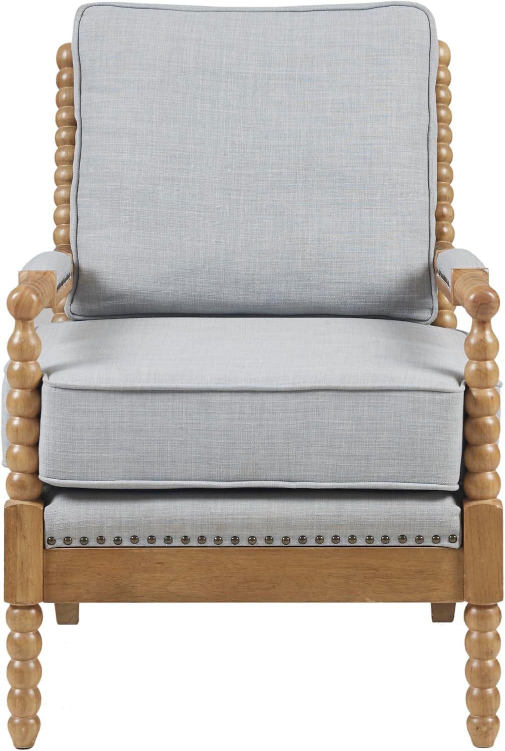 Front-facing light-blue upholstered armchair with bobbin-turned wood frame and bronze nailhead trim along the base.