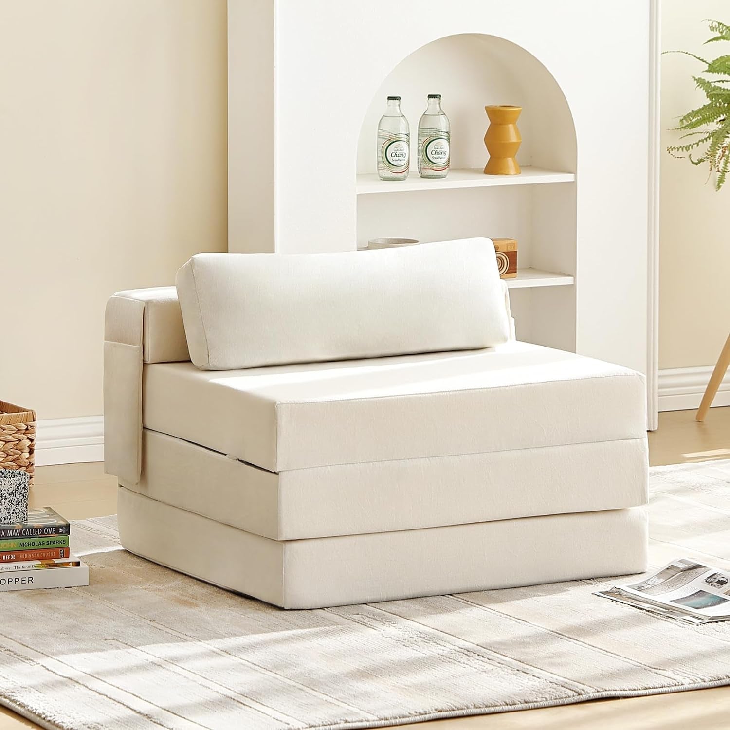 Beige foldable floor sofa chair with back cushion in a sunlit living room