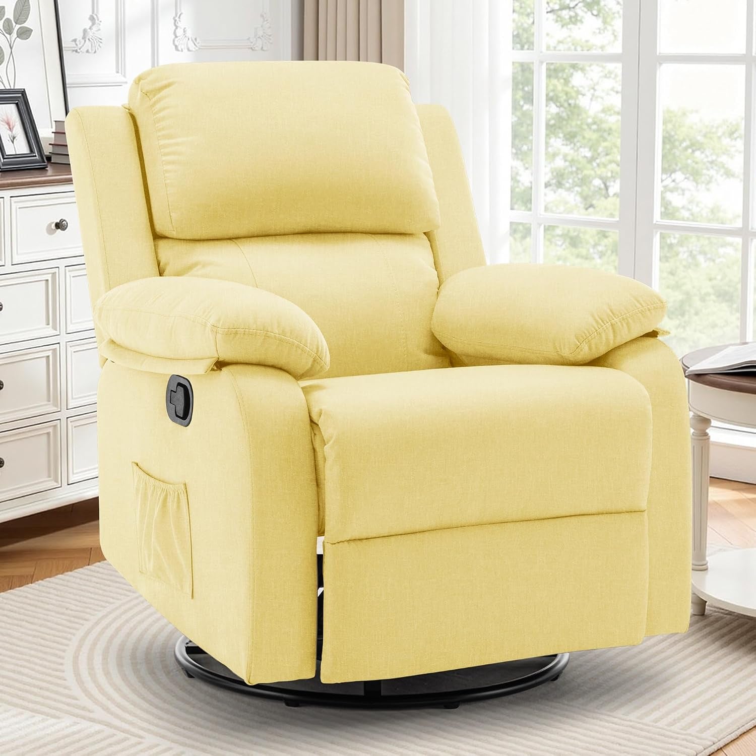 Yellow upholstered swivel rocker recliner shown in a bright room with window and side table.