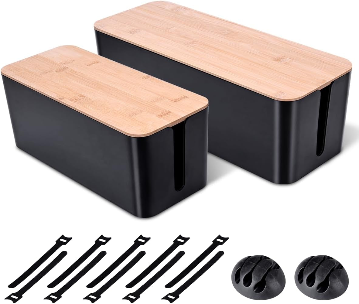 Two black cable boxes with bamboo lids shown with included cord ties and two round cable clips arranged below
