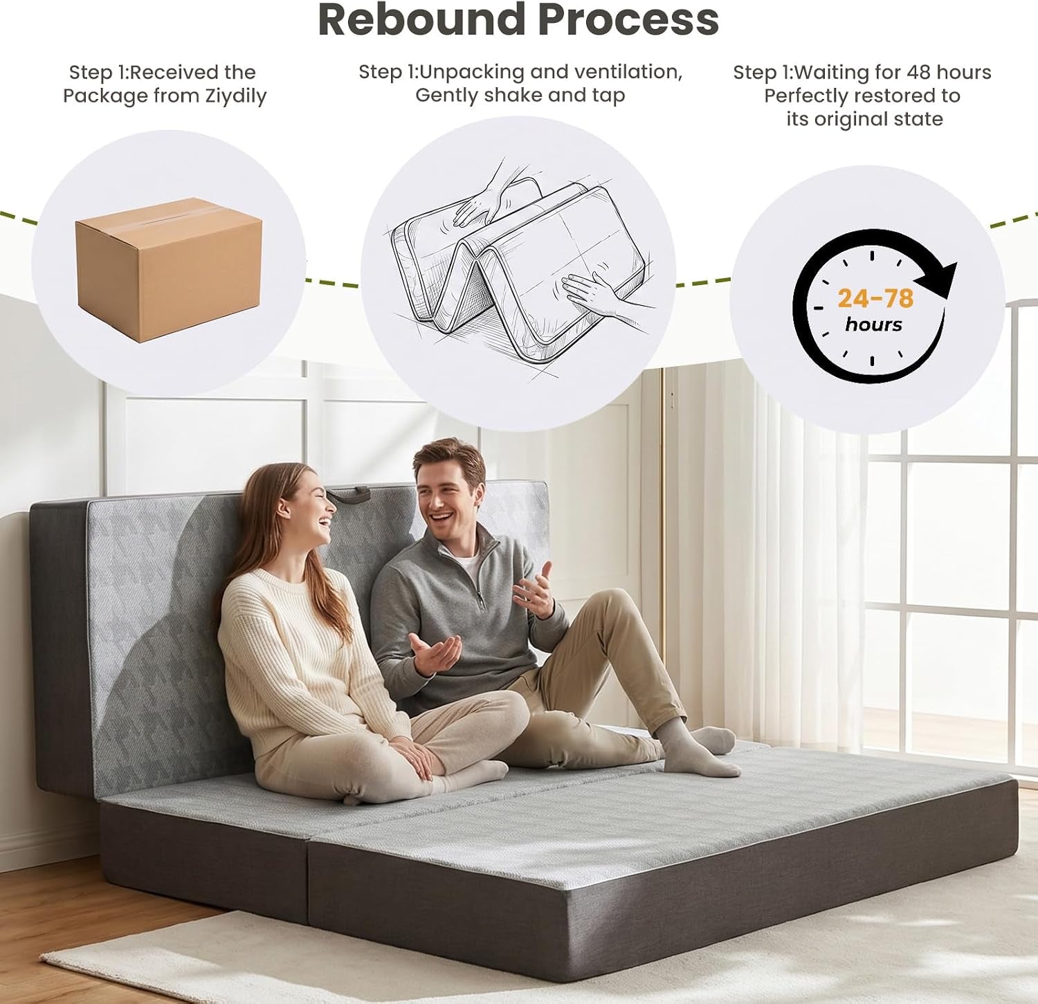 A couple seated on the unfolded grey trifold mattress used as a floor sofa with the folded section propped upright as a