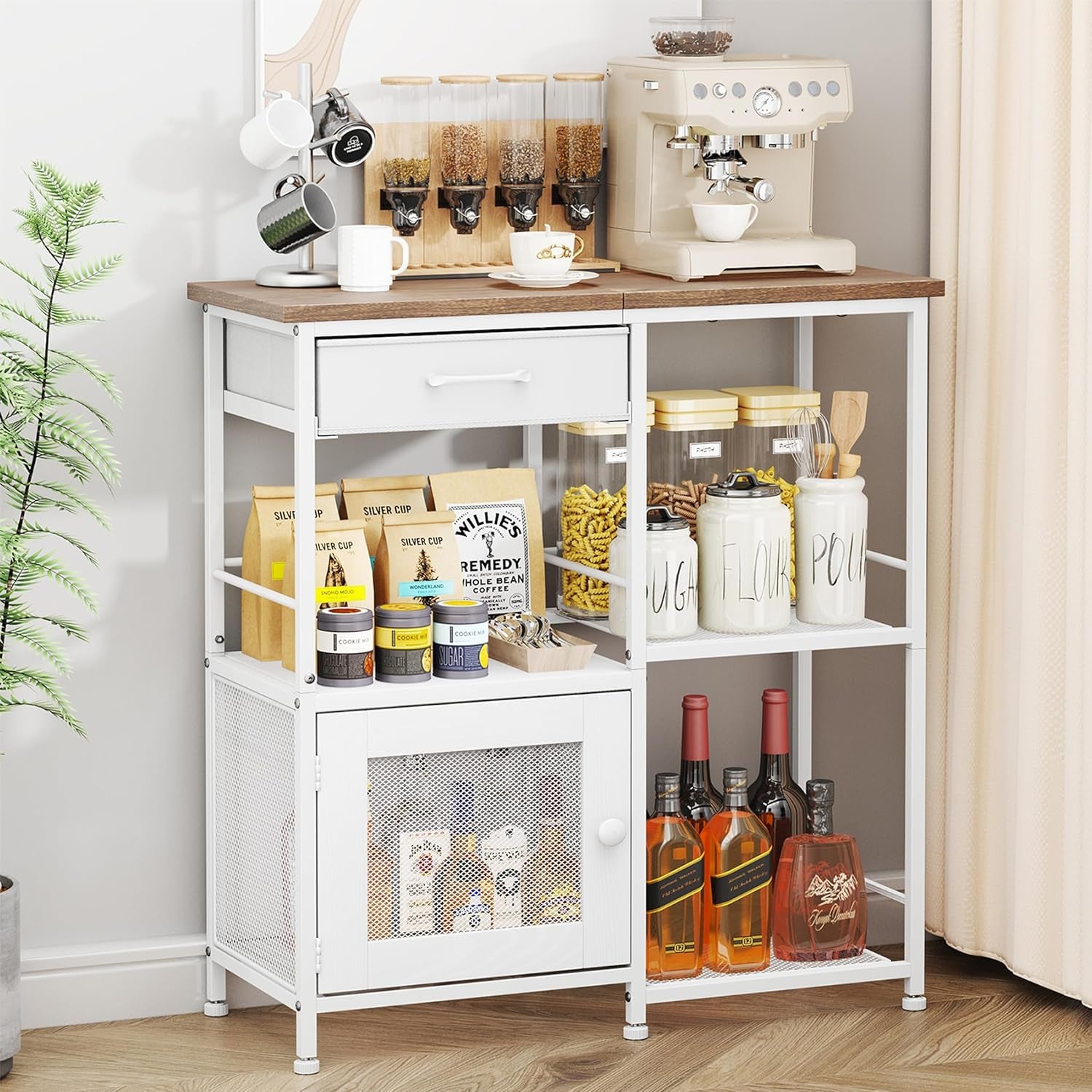 White metal-framed buffet with wood top, drawer and mesh-door cabinet styled with jars and bottles