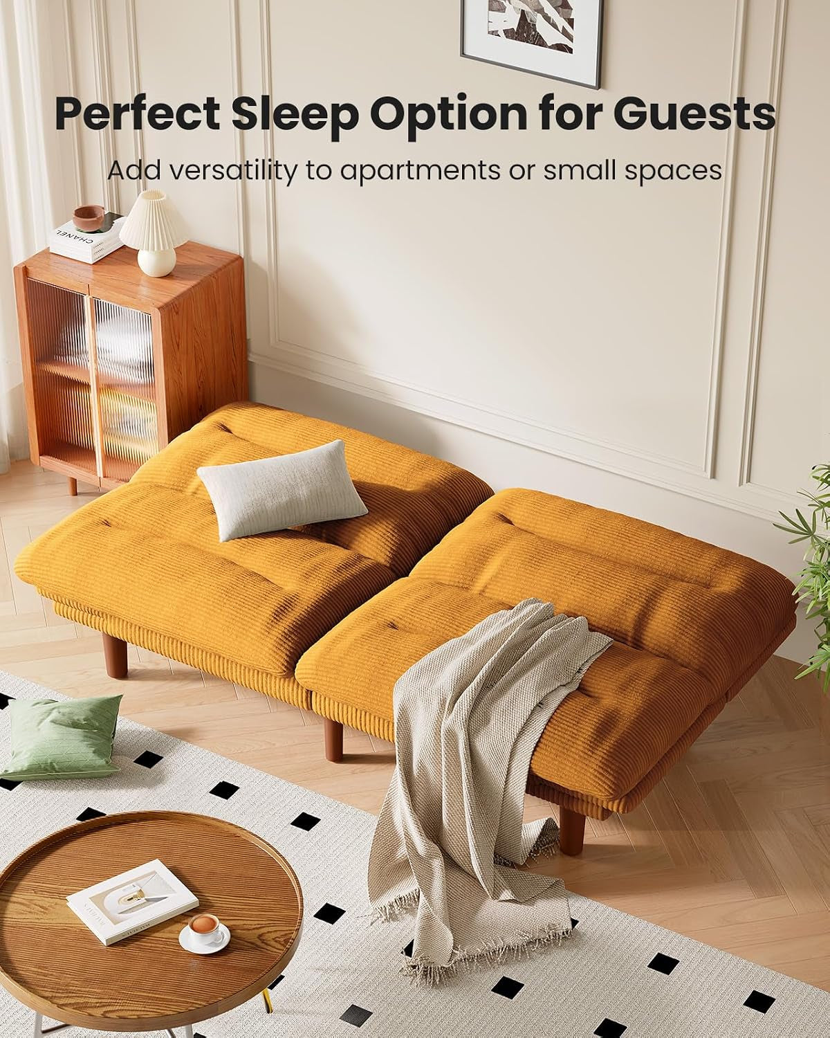 Top-down view of the futon laid flat into two adjacent sleeping surfaces, mustard-orange fabric with a throw and small