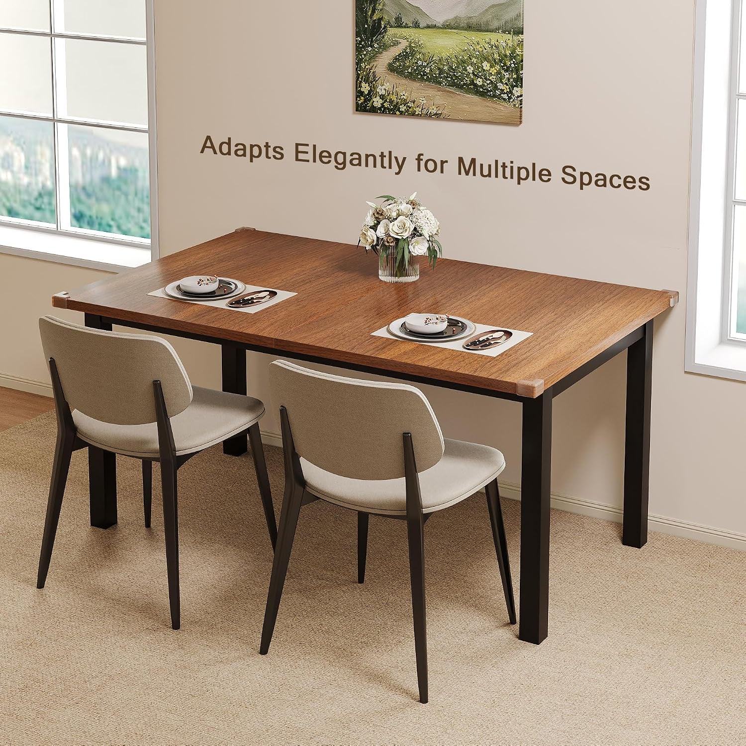 Rectangular dining table with wood top and black legs set for two near a window and wall art.