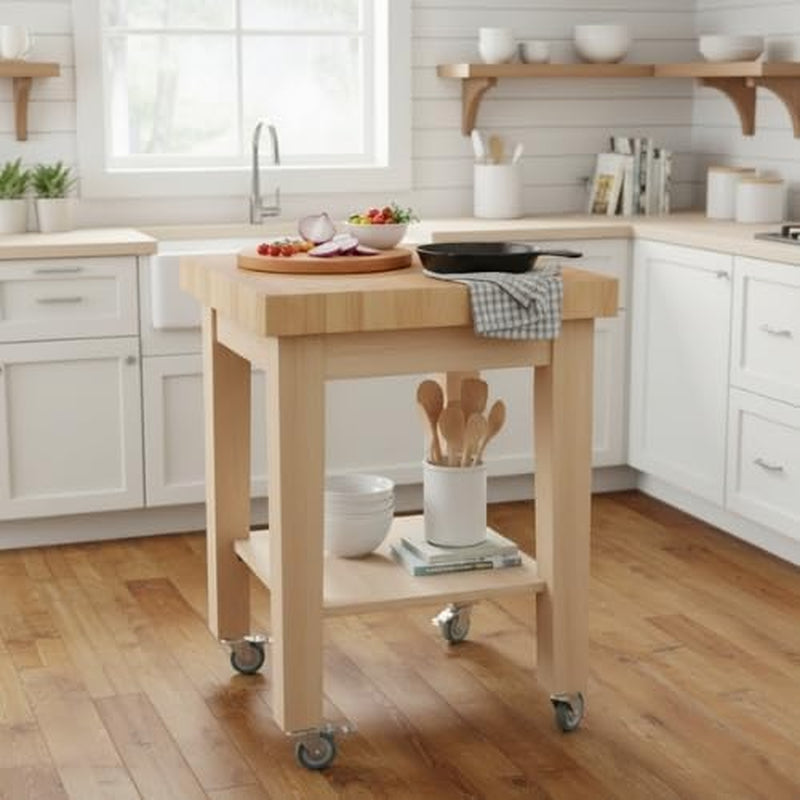 Natural wood kitchen island cart staged in a bright farmhouse-style kitchen on hardwood floors