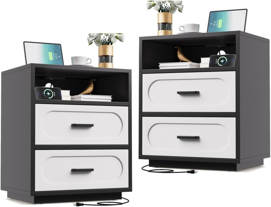 Two black-framed nightstands with white drawer fronts, open top shelf and visible charging cable on floor.