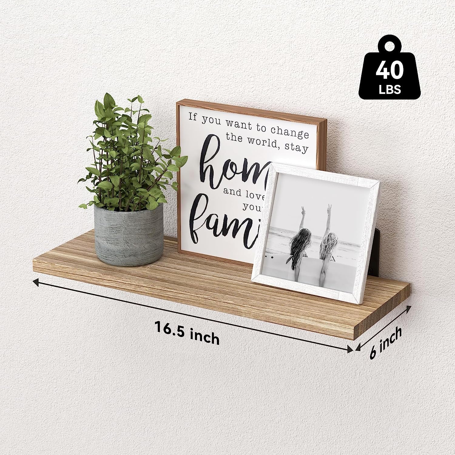 Single 16.5 x 6 inch rustic wood shelf with plant and framed prints and a visible 40 lb capacity icon