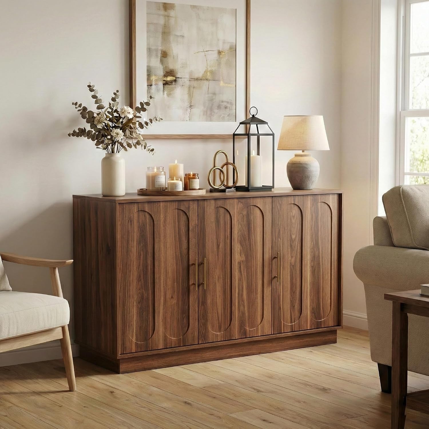 Angled front view of a brown storage cabinet in a living room setting with a lamp and decorative vase on top