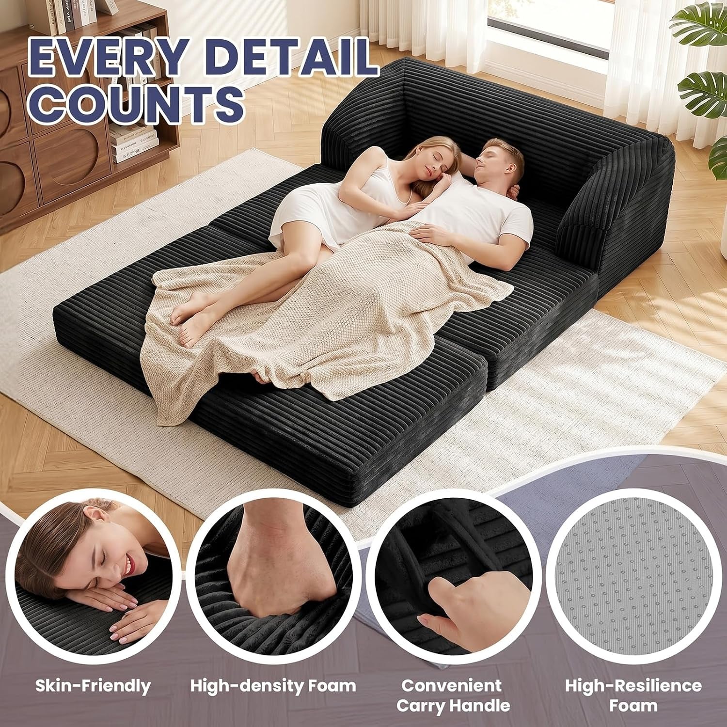 Black corduroy sofa fully unfolded into a flat guest bed with a couple lying on top
