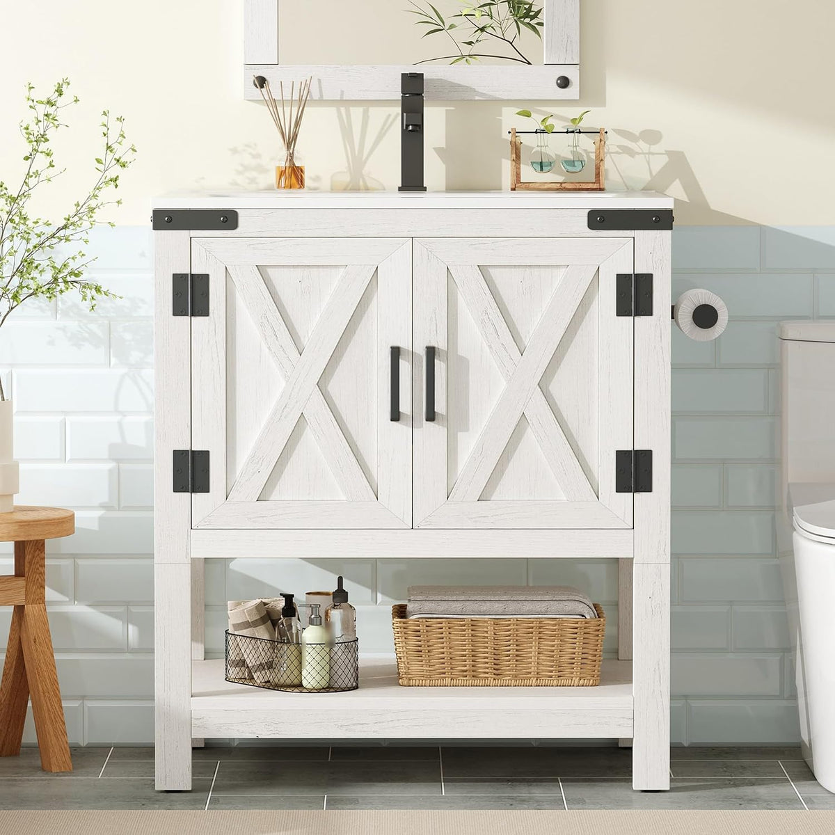 White single-sink vanity with X-panel cabinet doors, open shelf and woven basket, black faucet visible