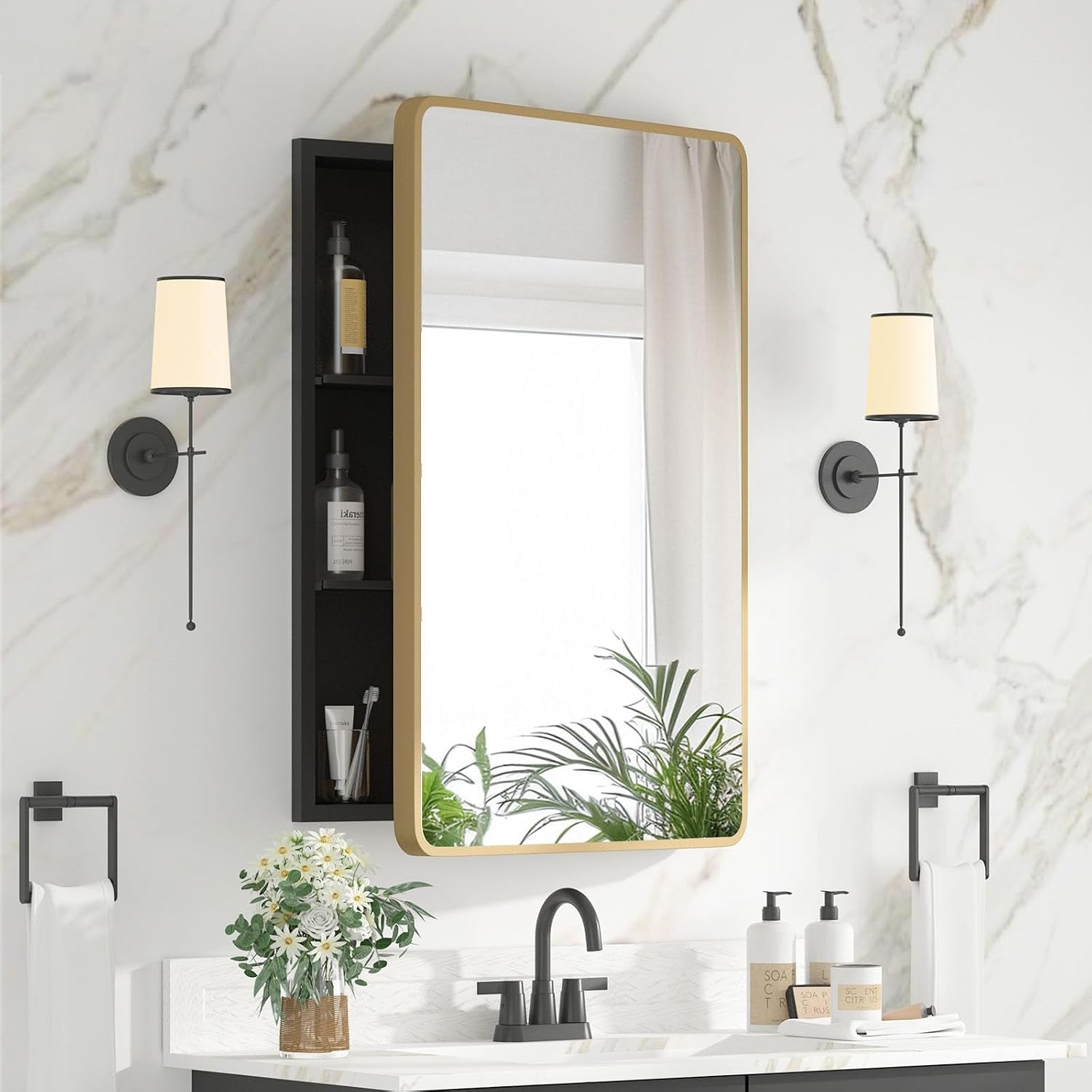Front-facing shot of the same cabinet in a gold-framed finish mounted above the vanity.