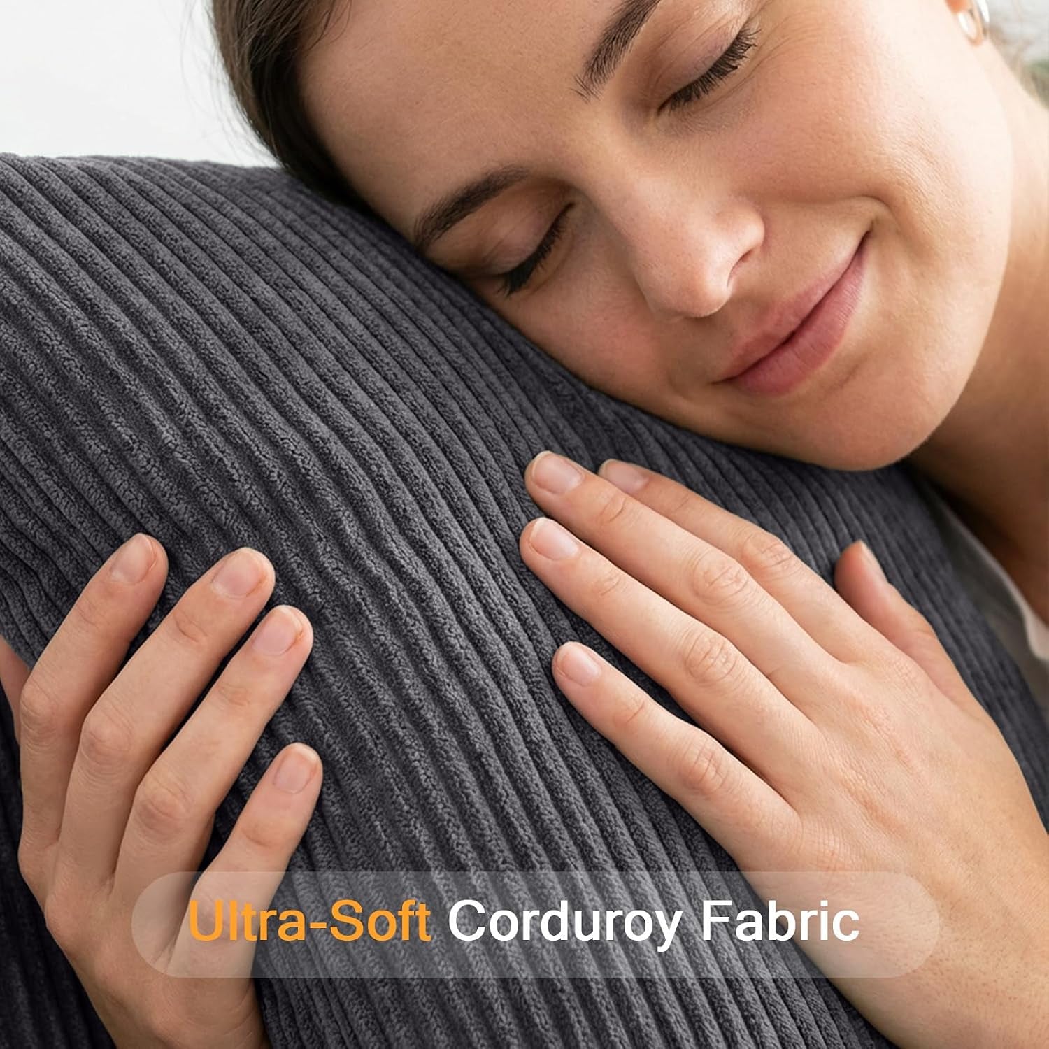 Close-up of ultra-soft dark grey corduroy fabric texture being hugged