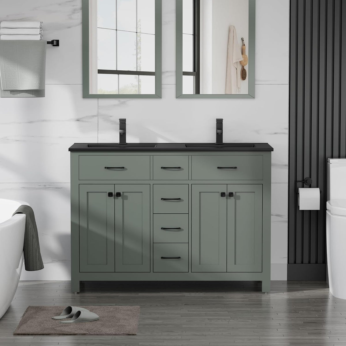 Wide sage-green double vanity with black countertop, twin faucets and two framed mirrors.
