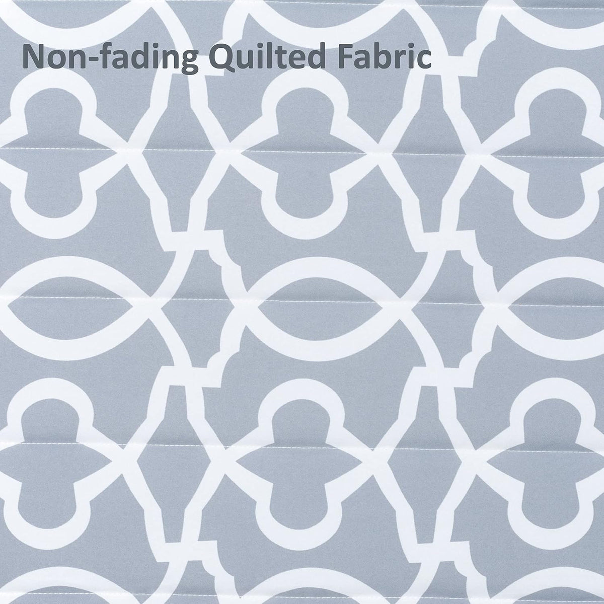 Close-up of grey patterned quilted polyester fabric showing stitched channels and repeating white motif