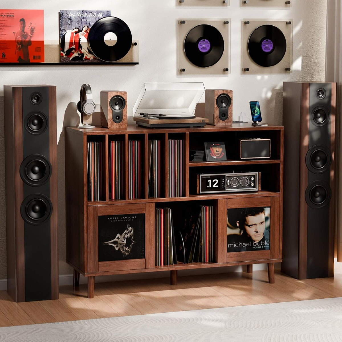 Full styled setup showing the record cabinet flanked by tall floor speakers and wall-mounted records.