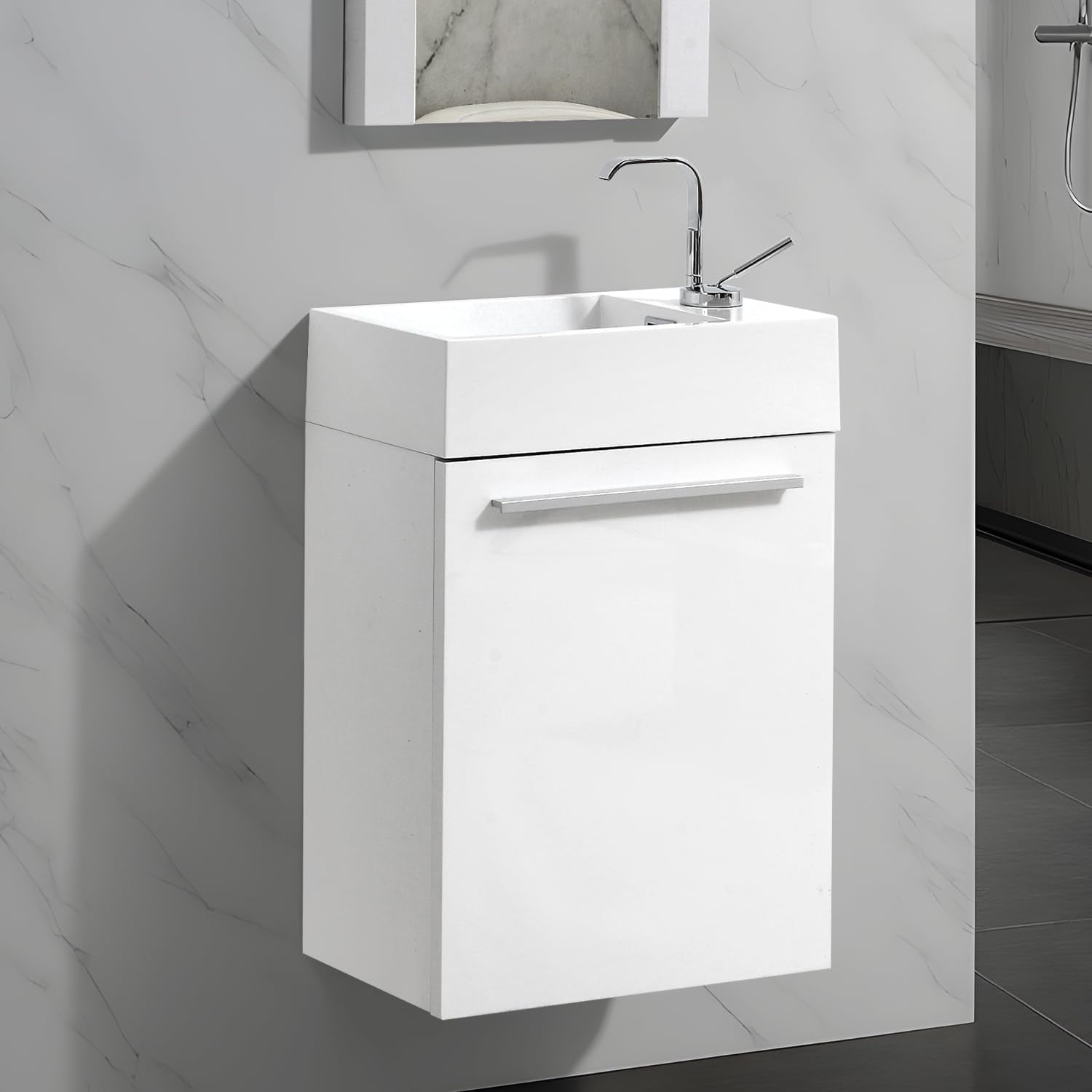 Close angled view of a white wall-mounted narrow vanity and rectangular sink with chrome faucet.