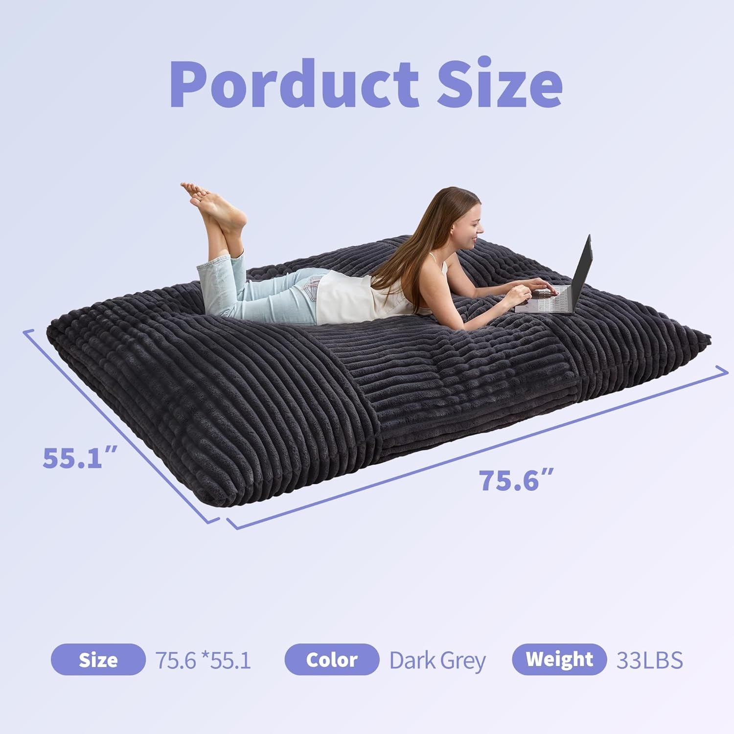 Flat dark grey floor cushion view with a person lying on it and graphic overlays indicating product size