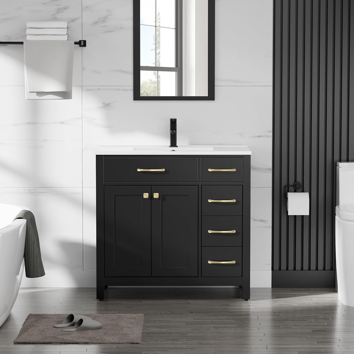 Front view of a single black bathroom vanity with white sink top and gold handles.