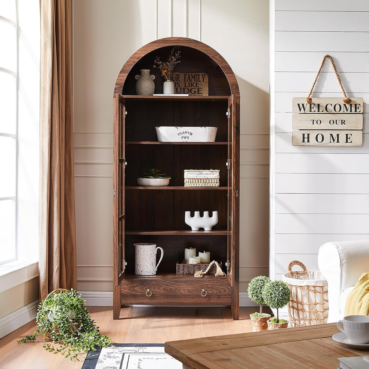 Front view of the arched cabinet bookshelf with its glass doors open