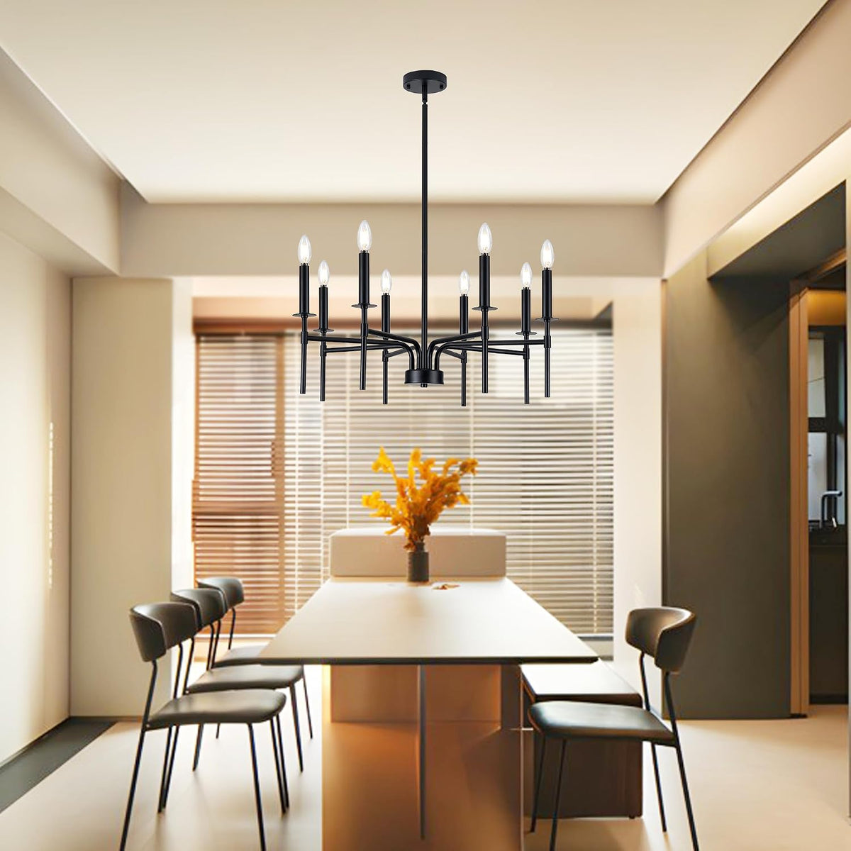 Black metal chandelier centered above a dining table with stools, straight-on view of the square-frame arms.