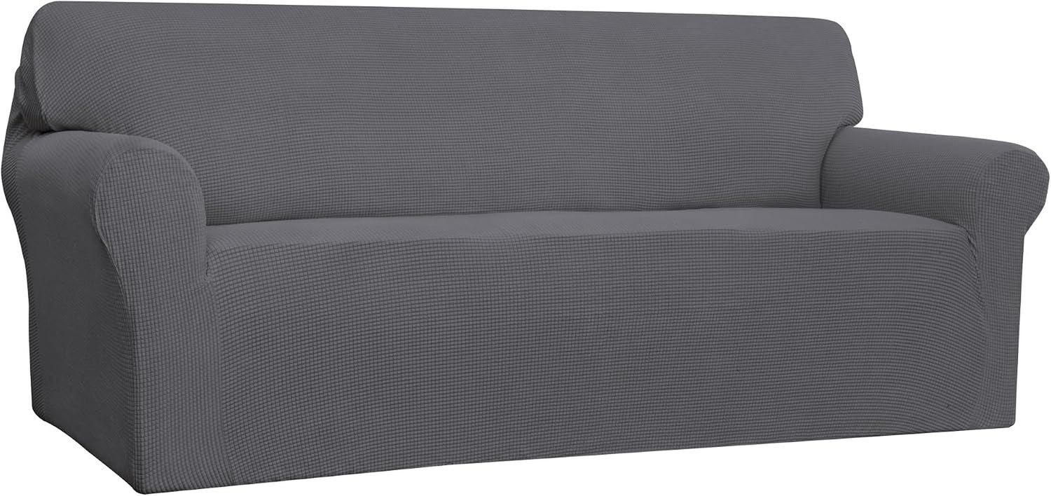 Right three-quarter view of a dark gray loveseat cover showing fitted arm contours and low-profile base.