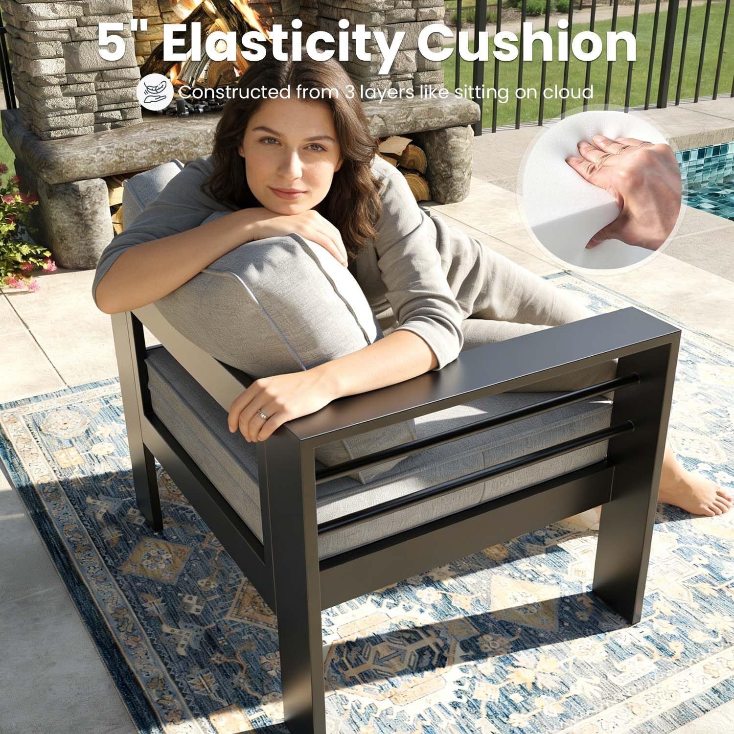 Single armchair with powder‑coated aluminum frame and grey 5‑inch cushion shown from a rear‑angle view