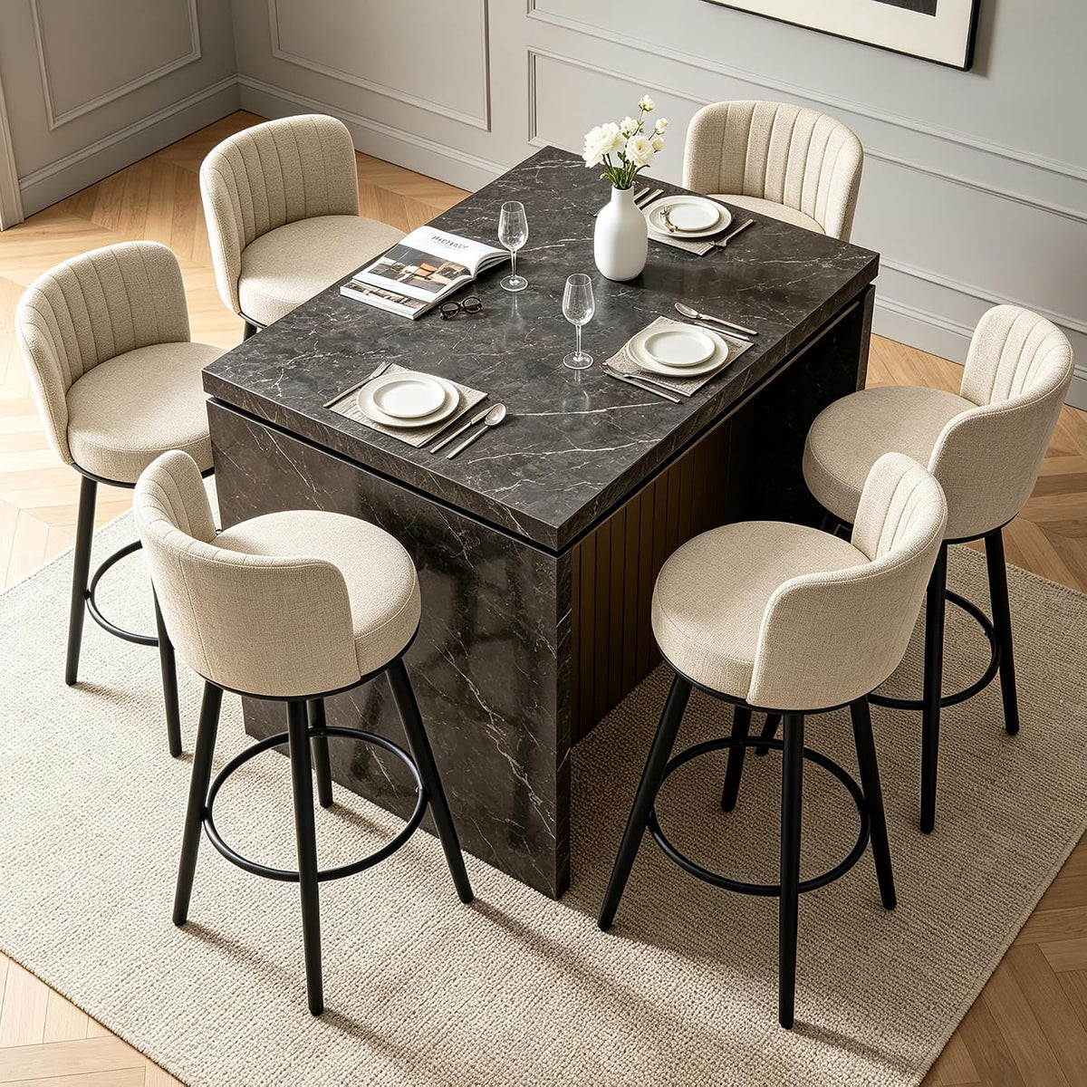 Bird’s-eye view of six beige swivel bar stools arranged around a dark rectangular island set for dining.