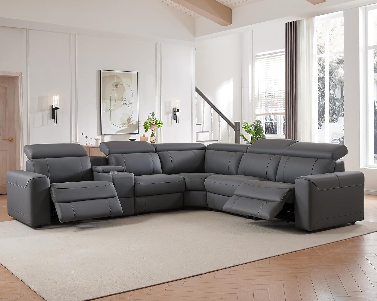 Gray power reclining sectional arranged in a bright living room with two recliners open