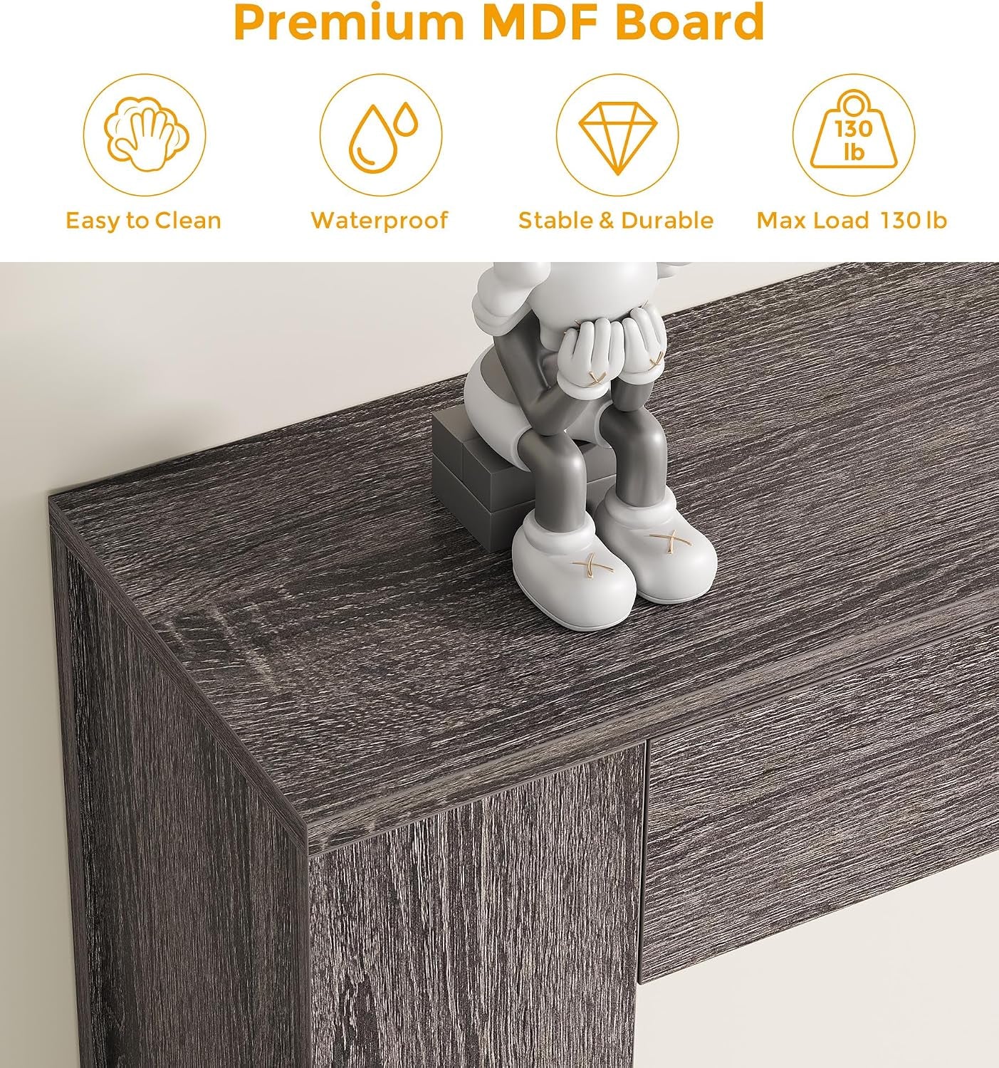 Close-up of the grey MDF tabletop texture and a soft leg pad at the base of the leg.