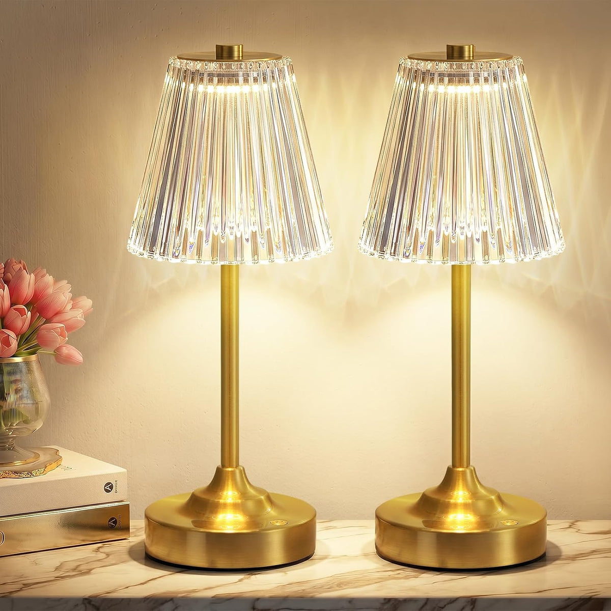 Two lit gold lamps side by side showing matching ribbed acrylic shades and round bases