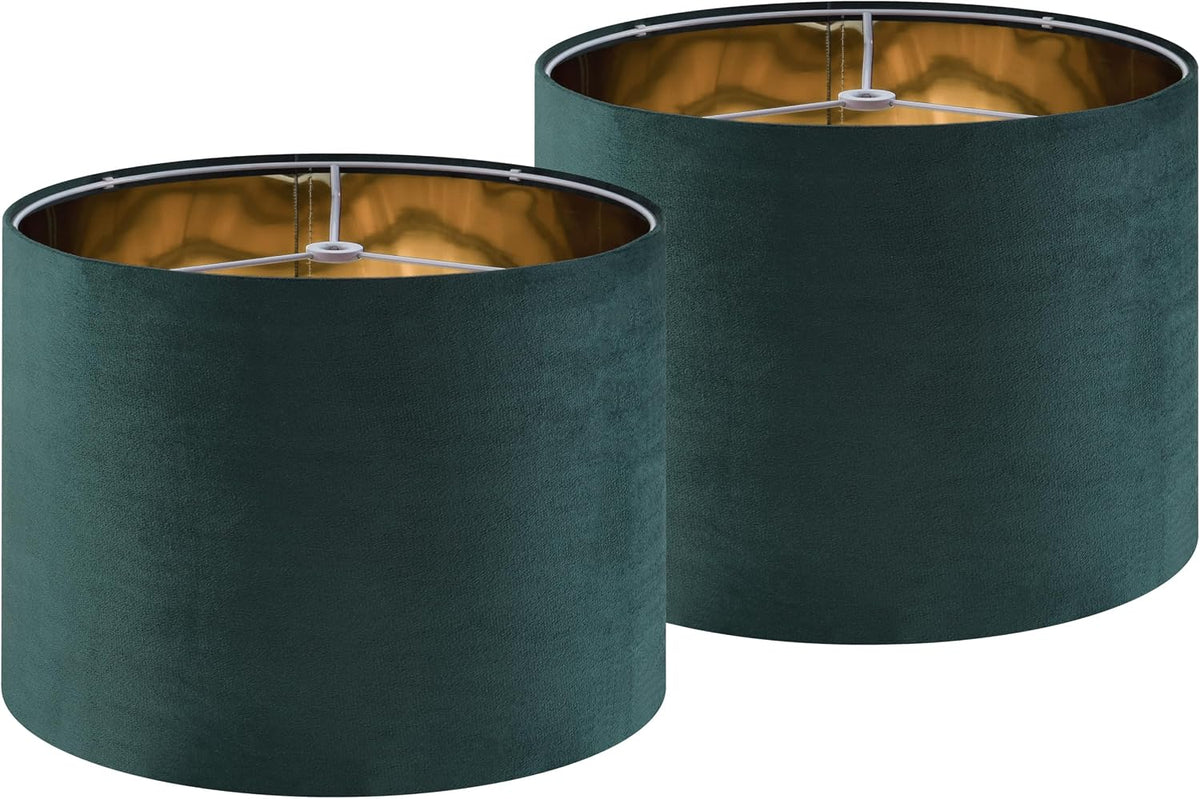 Pair of cylindrical dark teal drum lampshades with gold inner lining, angled side view