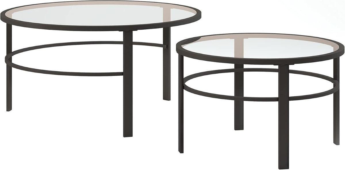 Pair of round nesting tables separated on a white background, showing clear glass tops and dark metal rings under the edge.