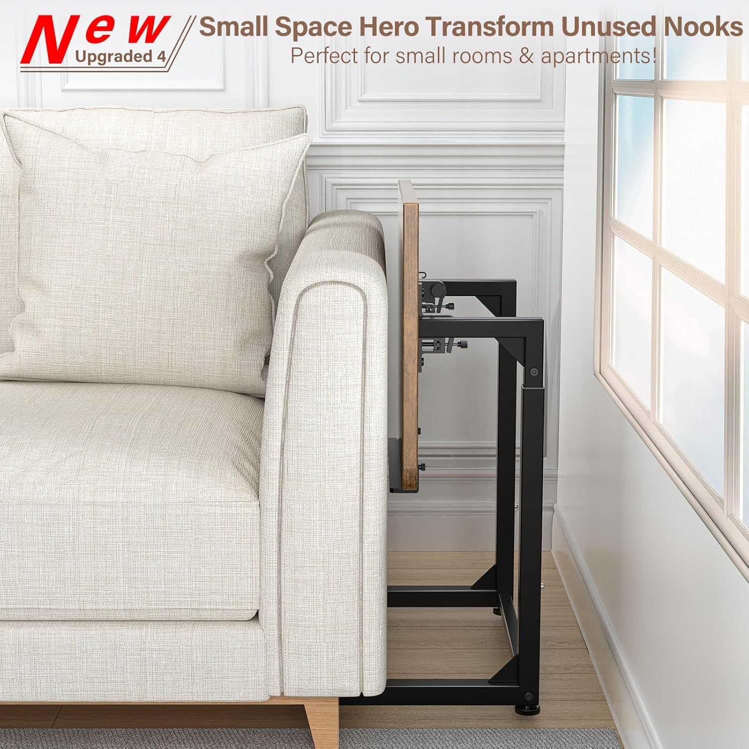 Side view of the C-table pushed flush against a light upholstered sofa arm, showing the metal frame and folded tabletop.