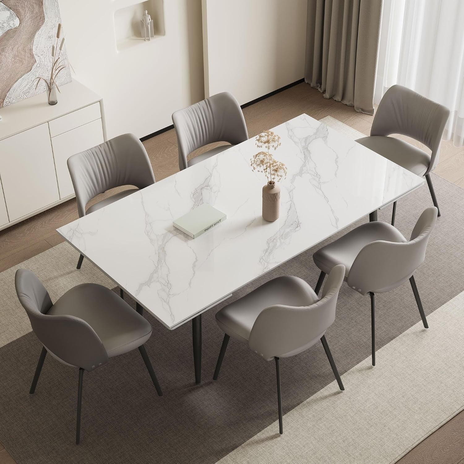 Overhead view of the white sintered stone tabletop in a dining room with eight surrounding chairs