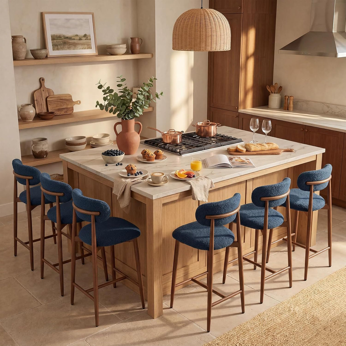 Large kitchen island surrounded by six blue upholstered counter stools with rounded backs.