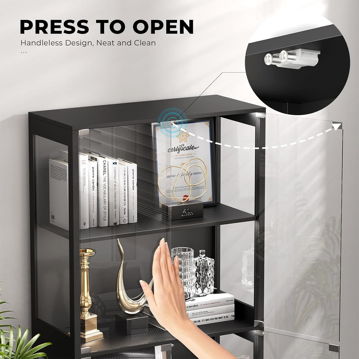 Close-up of the handleless glass door showing the press-to-open mechanism and a hand demonstrating the push-to-open