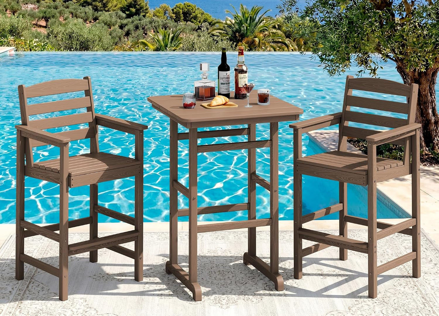 Brown Adirondack bar set beside a bright pool with drinks on the square tabletop, outdoor setting