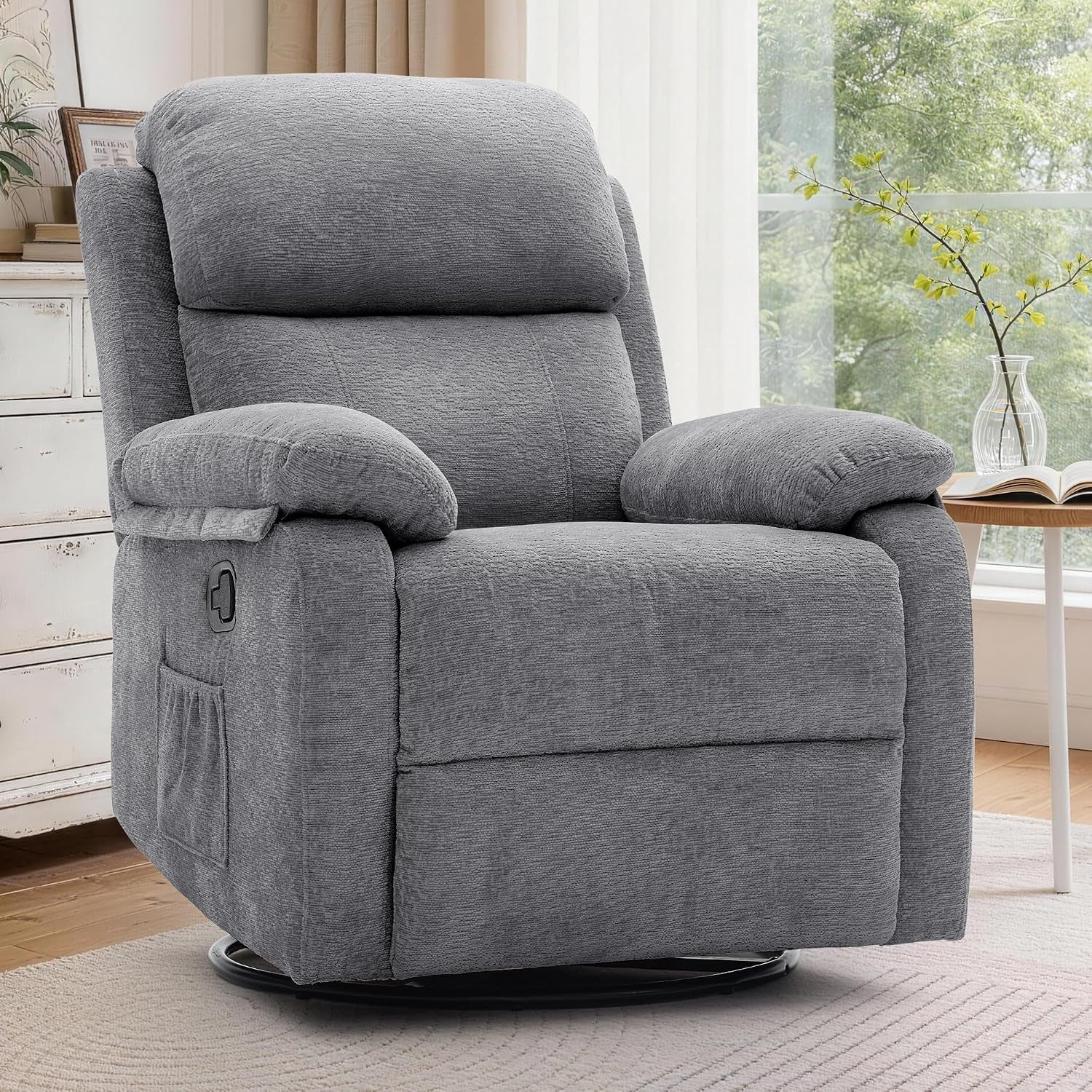 Charcoal gray upholstered glider recliner shown beside a window and white dresser.