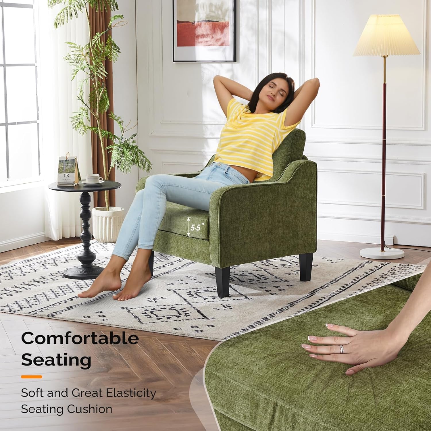 Person reclining in the green accent chair in a sunlit living space with a hand pressing the cushion