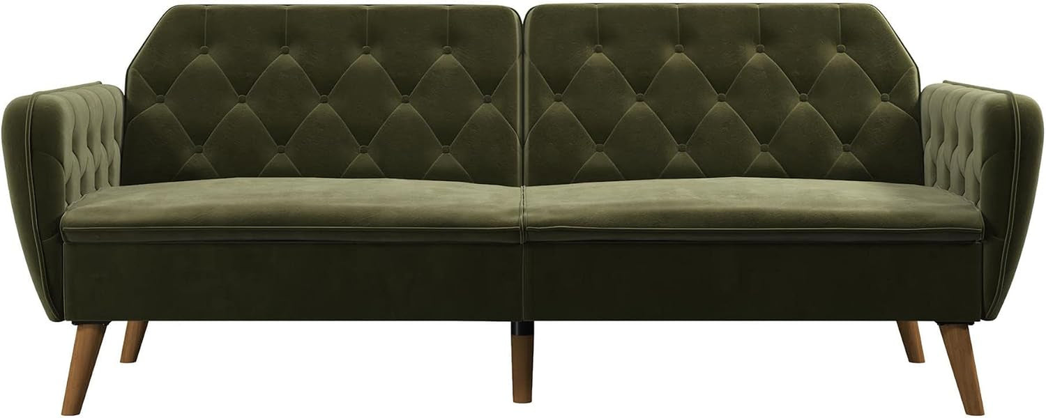 Front-facing view of green velvet futon showing split-back tufting and inner armrests