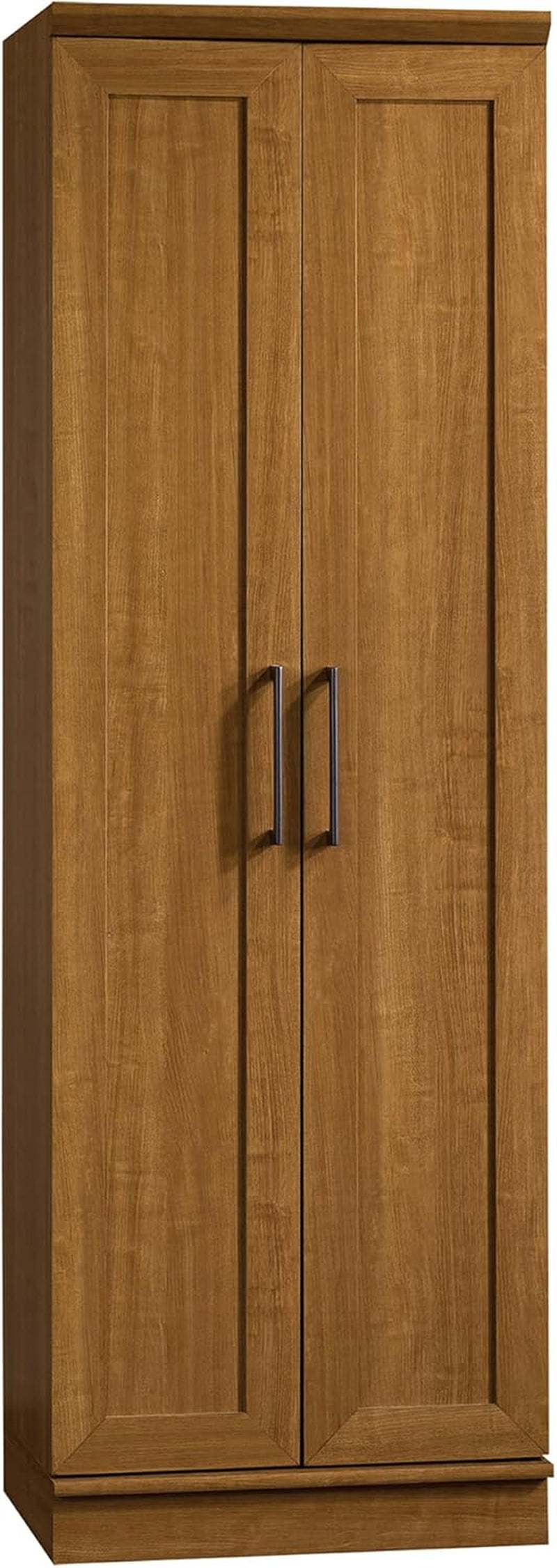 Tall two-door wood cabinet in warm oak finish with recessed panel doors and two vertical metal handles.