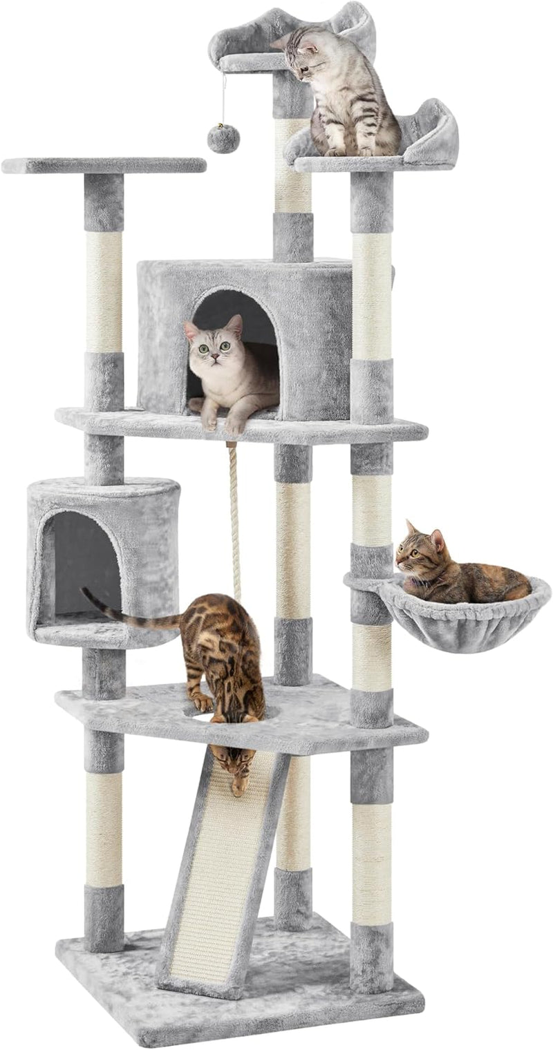 Tall multi-level cat tree in light gray shown with several cats on platforms, condos and a hanging pom-pom toy.