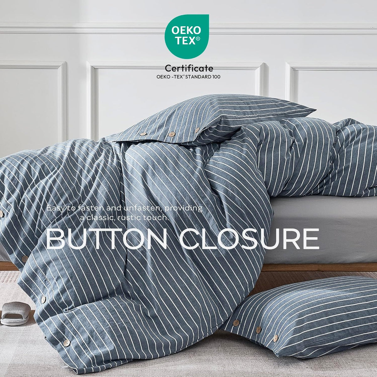 Close-up of blue striped duvet and pillow showing wooden button closures and draped fabric on a bed edge.