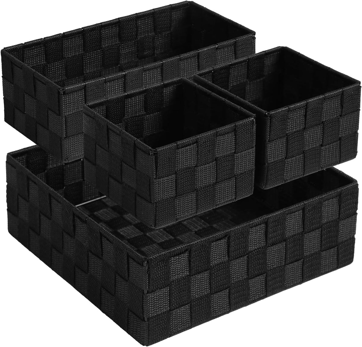 Three small and two large black woven baskets stacked at an angle on white background